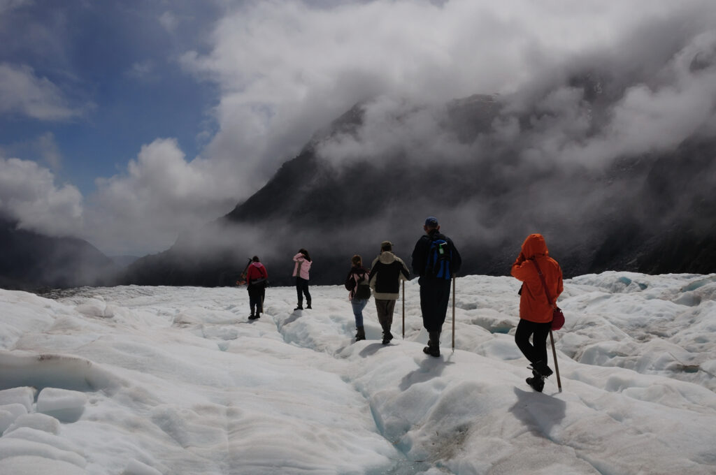 Hiking & Ice Climbing Fox Glacier, New Zealand on a clear day